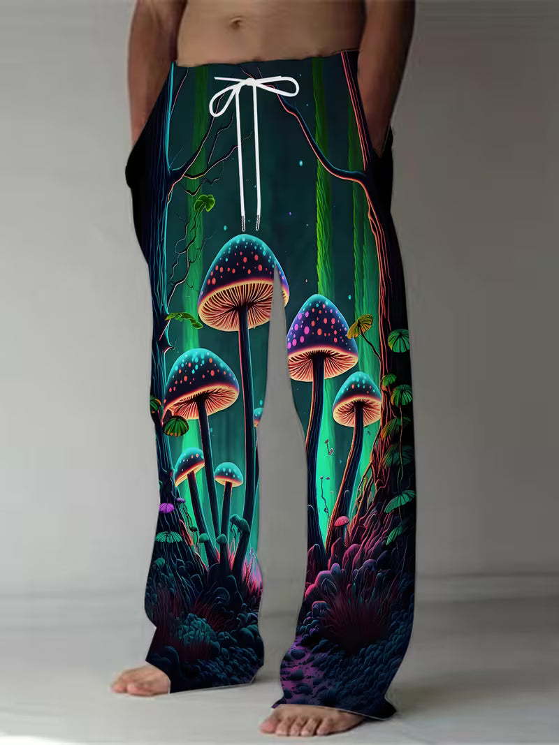 Glow forest mushroom psychedelic jogger trousers with bioluminescent fungi artwork worn at the beach in the UK 1