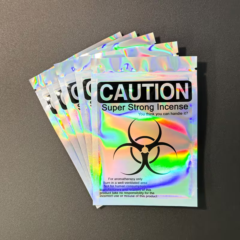 Holographic resealable Mylar seed storage bags with iridescent finish and caution-style design, suitable for small collectible seed storage