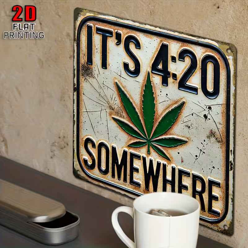 Vintage metal wall sign reading “It’s 4:20 Somewhere” with green leaf design