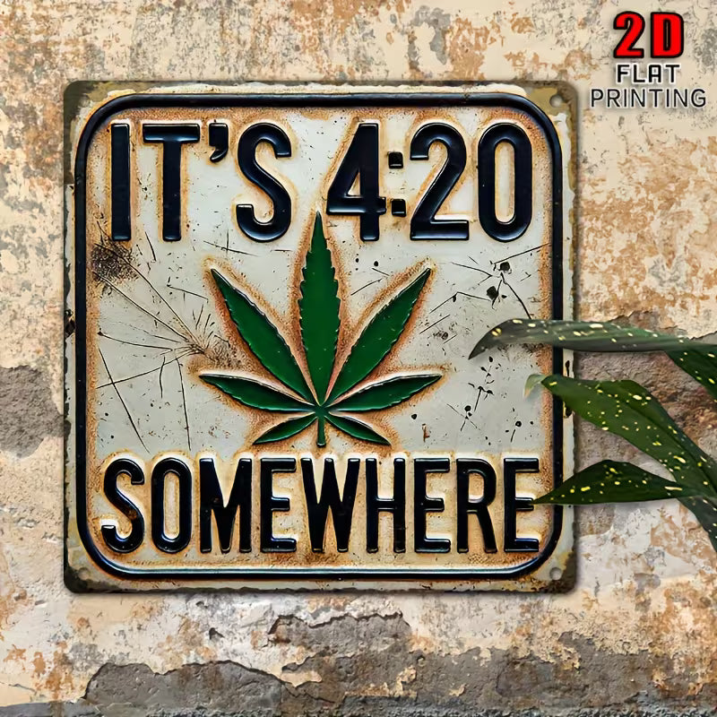 Vintage metal wall sign reading “It’s 4:20 Somewhere” with green leaf design