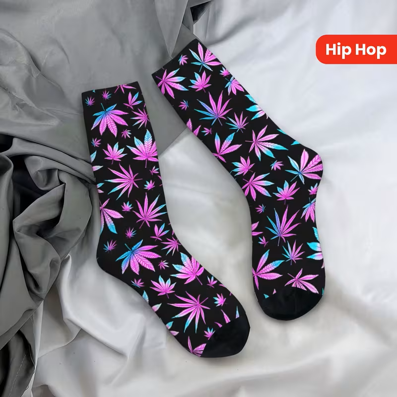 Pink and blue cannabis leaf socks black background side by side